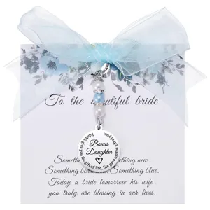 Bridal bouquet charm with blue ribbon and pearls, perfect wedding keepsake gift for bride.