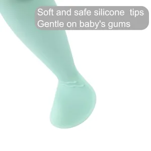 Silicone baby spoon with soft tip, safe infant feeding utensil, cute green design for kids.