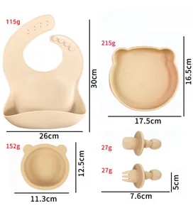 Silicone baby feeding set with bear plate, bowl, bib and fork spoon for infants and toddlers.