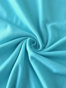 Light blue cotton fabric material texture detail close-up shot for casual blank t-shirt