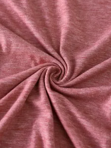 Soft heather cotton fabric texture close up view, comfortable knit material details for apparel.