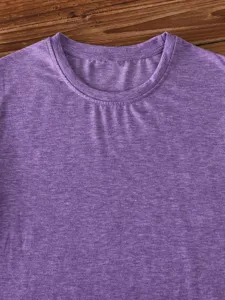 Close-up detail of purple heather crew neck short sleeve t-shirt collar and soft fabric texture.