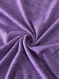 Purple heather cotton fabric detail, soft knit texture close-up for custom blank t-shirts.