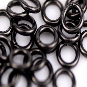 Detail view of 3mm black open jump rings for DIY jewelry making and craft accessories.