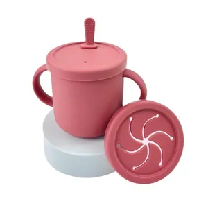 Pink silicone baby training cup with dual handles, snack lid and straw lid for toddlers.