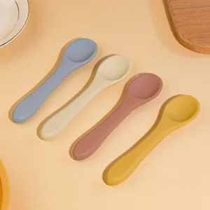 Silicone baby spoon set with long handle, food grade pastel infant training tableware.
