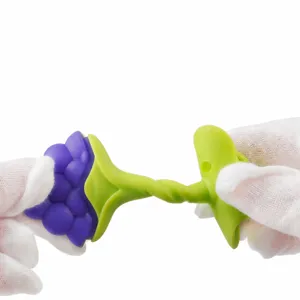 Silicone baby teether toy, soft and chewable grape design for infants oral stage relief.