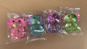 Cute axolotl squishy toy set, slow rebound TPR stress relief toy with glitter, 4 colors.