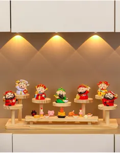 Creative entryway display stand with cute cartoon wealth figurines on multi-layer wooden shelf.