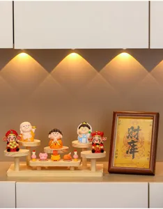Wooden tiered display stand detail view, featuring cute cartoon figurines and mini decor frame.