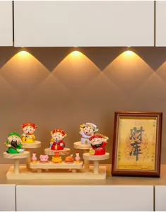 Wooden multi-tier display stand with cute cartoon god of wealth figurines for home office decor.
