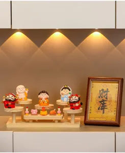 Creative entryway wooden display stand with cute cartoon figurines and mini decor details.