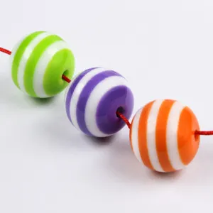Colorful striped resin beads detail, DIY jewelry making loose round beads, vibrant color choice.