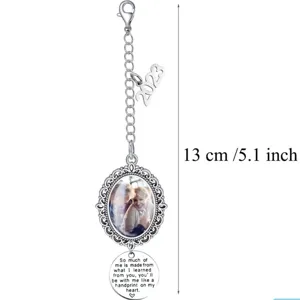 Detail view of DIY photo memorial pendant keychain with oval filigree frame and 2023 charm.