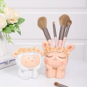Cute cartoon animal flower pot and pen holder for cute desk decor and functional storage.