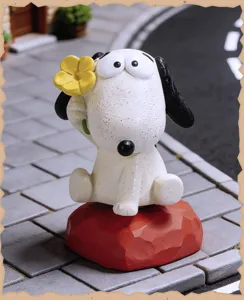 Cute cartoon puppy figurine holding flower resin desktop decoration ornament for home office desk.