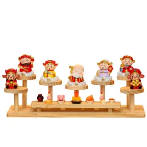 Wooden display stand with cute cartoon lucky gods figurines for home office decor.