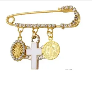 Broche epingle de securite dores vintage avec strass croix et medailles religieuses femme
