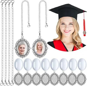DIY photo pendant detail showing oval bezel trays, stainless steel chains, and graduation cap charm.