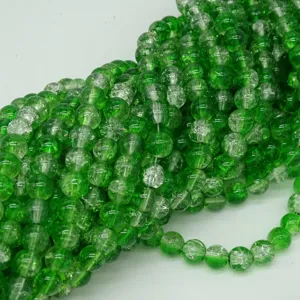 Close-up detail of vibrant green crackle glass beads, perfect for DIY jewelry making accessories.
