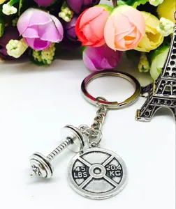 Fitness inspirational metal keychain with dumbbell and weight plate pendant, fashion accessory.