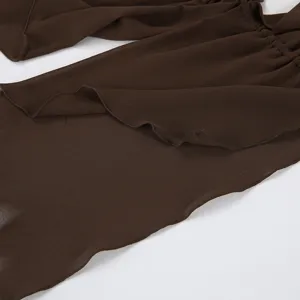 Dark brown summer halter top fabric detail showcasing elegant ruched and ruffled design.