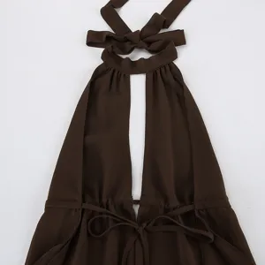 Close-up detail of the brown halter neck sleeveless top featuring front cutout and waist tie.