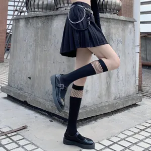 Black hollow mesh spliced calf socks, trendy JK half-tube socks detail view showcasing fishnet style.