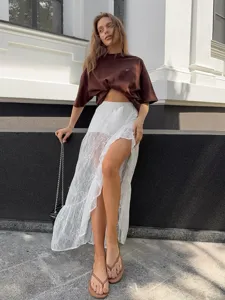 Gonna midi trasparente in pizzo dolce irregolare con spacco alto in stile europeo chic per donna