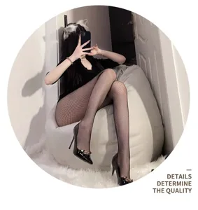 Detail shot of sexy black fishnet pantyhose, highlighting hollow mesh texture and slim fit.