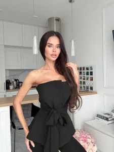 Black strapless tie-waist peplum tube top for women, stylish summer slim-fit fashion clothing.