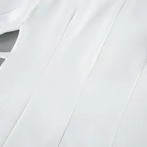 White blazer detail close up, refined tailoring fabric texture, elegant commuting apparel.