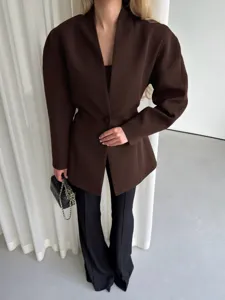 Chic women's V-neck blazer with structured shoulders and cinched waist for autumn commute.