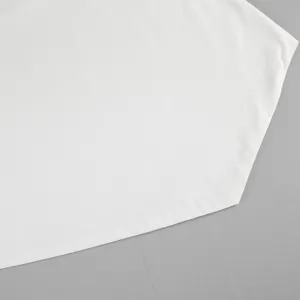 Close-up view of the smooth white fabric detail showcasing fine texture and neat hemline.