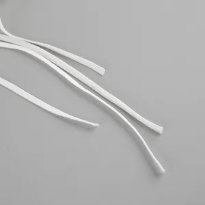 Detailed view of white thin clothing straps and ties, perfect for casual women apparel tops.