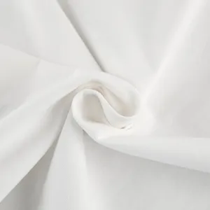 White fabric texture detail close up soft woven material plain solid color view.
