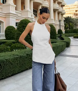 Detail view of the elegant white backless halter top, showcasing the stylish outdoor design.