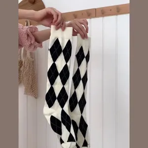 Classic black and white argyle pattern knee high socks, perfect for JK style and daily wear.