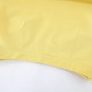 Gelbes Sommer Damen Anzug Detail, hochwertiger Stoff mit sauberen Nähten und Design.