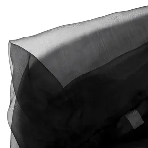 Detailed close-up shot of black sheer mesh fabric, showing lightweight translucent fashion texture.