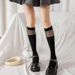 Black fishnet patchwork knee high socks for women, trendy summer jk Lolita hosiery.