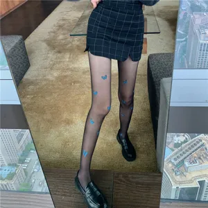 Sexy black sheer tights featuring delicate blue butterfly print, thin and stylish leg wear.