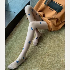 Sheer tights detail showcasing blue butterfly print pattern on translucent fabric for summer.