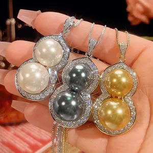 Stunning double pearl gourd pendant necklace with sparkling zirconia and exquisite chain.
