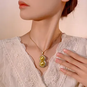 Elegant gold pearl gourd pendant necklace for women, stylish and charming jewelry accessory main.