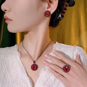 Elegantes orange-rotes Zirkon Blumen Schmuckset mit Ohrringen, Kette und Ring.