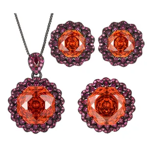 Detailansicht des luxuriösen Schmucksets mit schwarzem Gold und leuchtenden orangen Zirkonen.