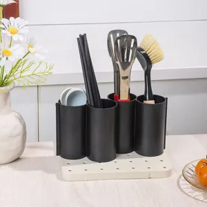 Close-up detail of the four-compartment utensil holder, showing practical kitchen storage.