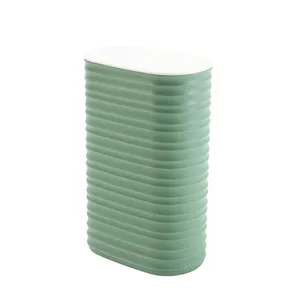 Close-up detail of the ribbed green storage container with white lid, showing texture.