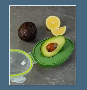 Detail view of the green avocado saver container, perfect for keeping fruits fresh and crisp.